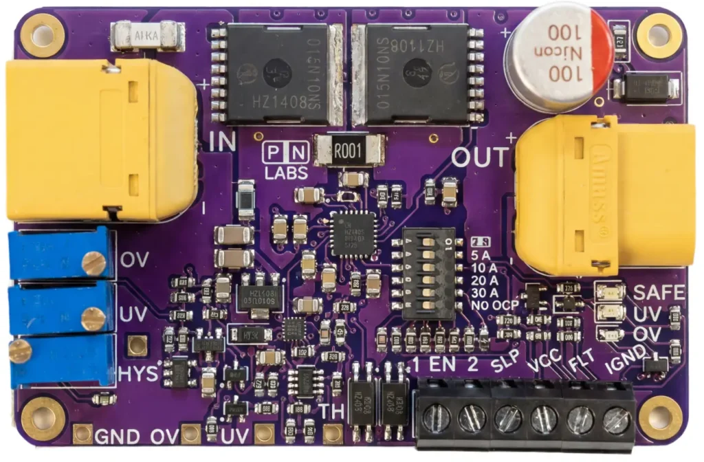 Top-down photograph of the PN Labs Protect+ board, showing the yellow IN and OUT connectors, two external TO-263 MOSFETs beside an R001 shunt, blue OV, UV and HYS trimmers, a DIP switch selecting 5, 10, 20 or 30 A or no over-current protection, and a six-way screw terminal with SAFE, UV and OV indicator LEDs.